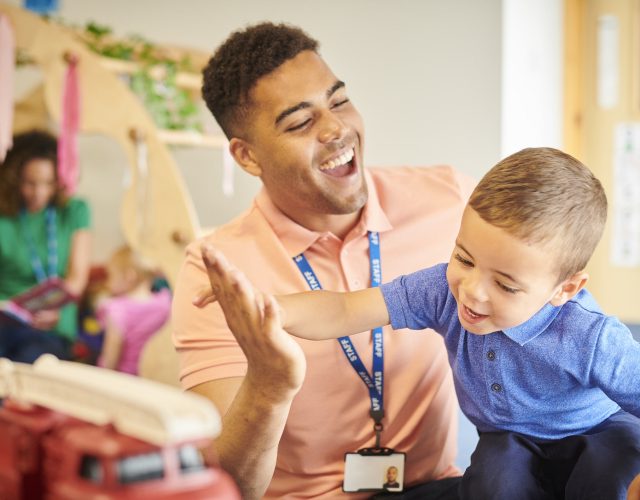 nursery teacher with student